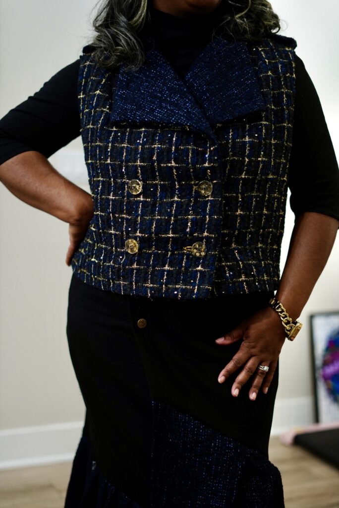 Handmade outfit featuring the Alba Skirt by Keechiibstyles and a shortened trench vest from McCalls 7749. The skirt is crafted from dark wash denim with layered tweed ruffles, while the tweed vest is adorned with shimmering sequins for added texture and elegance.