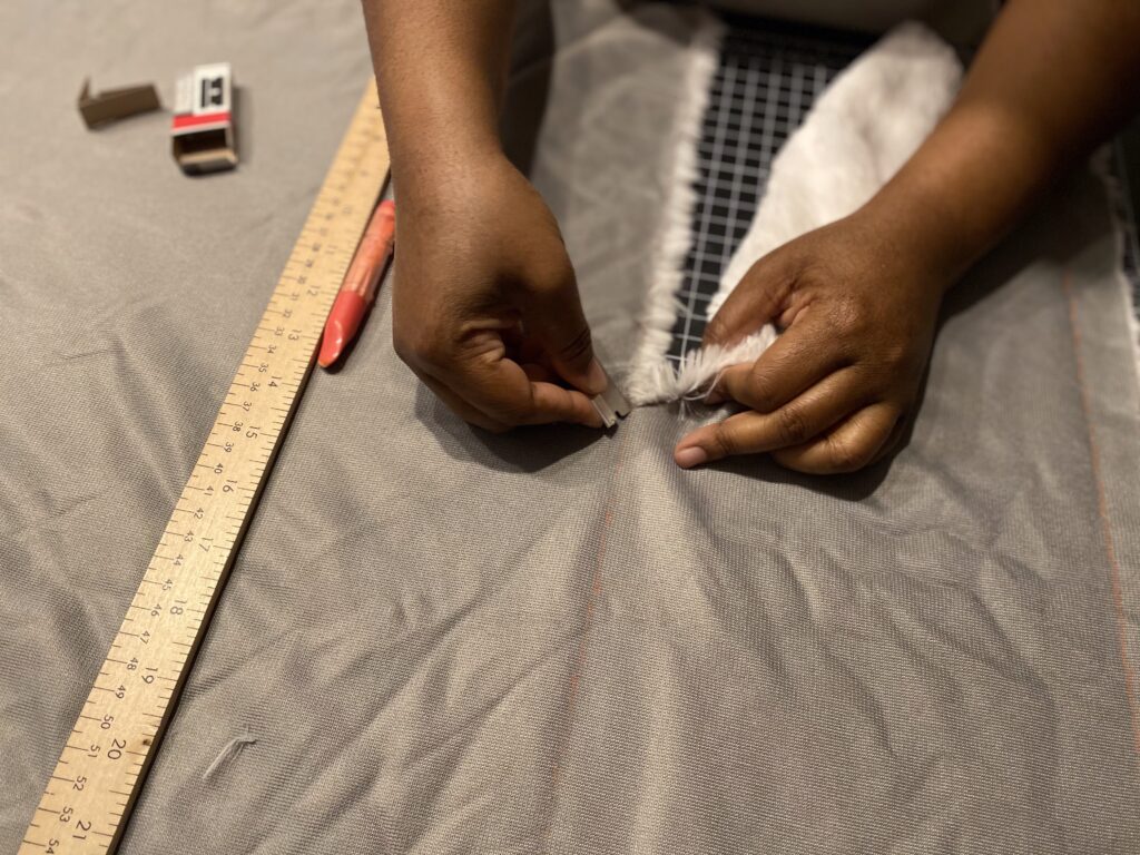 razor_cutting_backing_of_faux_fur